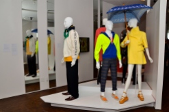 From Left to Right: David Chu (Nautica men’s day ensemble, 1990s: White cotton/nylon sailing anorak, yellow branded fleece, navy cotton corduroy pants, brown leather boat shoes), Humberto Leon and Carol Lim (Men’s day ensemble, Spring/Summer 2008: Lime and blue cotton hooded sweatshirt, ACT UP cotton T-shirt, striped cotton pants, orange Timberland collaboration sport shoes. Women’s day ensemble: Lemon cotton flare coat, spring/Summer 2006; yellow patent Robert Clergerie collaboration sandal platform, Spring/Summer 2011: square Guy de Jean collaboration umbrella, 2011)